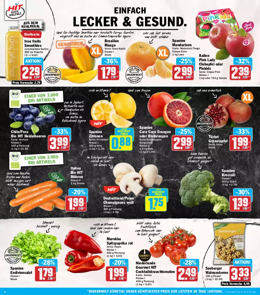 Aktueller Prospekt Hit - Wochenprospekt - von 13.01 bis 18.01.2025 - strona 2 - produkty: apfel, auer, aus dem kühlregal, beere, beeren, Berger, beutel, bio, bio hit, Blutorange, braten, broccoli, champignon, champignons, cocktail, cocktails, curry, discount, eis, flasche, fleisch, frucht, fruchtfleisch, glasflasche, grana, granatapfel, heidelbeere, heidelbeeren, joghur, joghurt, kuchen, kühlregal, kühlschrank, mac, mandarine, mandarinen, mango, möhren, nuss, obst, orange, orangen, paprika, paprika rot, Pfannkuchen, Pink Lady, Rana, Rauch, regal, reis, salat, salate, Schal, Schale, Schrank, seeberger, smoothie, smoothies, snack, Spitzpaprika, strauchtomaten, Ti, tisch, tomate, tomaten, true fruits, vita, Vitamin C, walnuss, walnusskerne, zitrone, zitronen, ZTE